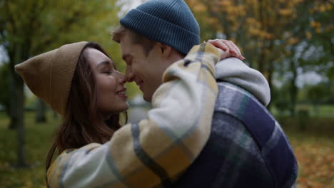 romantic young couple in love cuddling outdoors