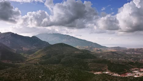 Aerial-view-of-mountains-and-hills-under-dramatic-cloudscape-in-Muğla-province,-Datça-town,-Turkey