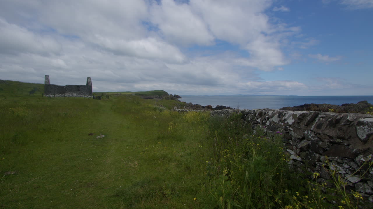 Wide shot of St Ninian’s Chapel and Stein head at Isle of Whithorn bay