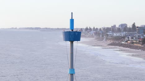 cinematic drone close-up of iconic brighton beach tower and jetty and suburbs, adelaide, south australia