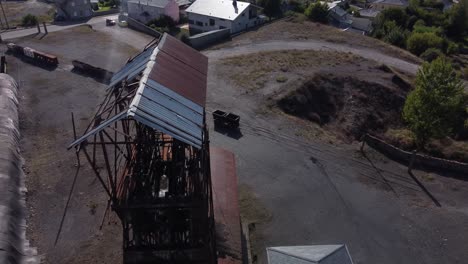 Ancient-mine-tower-and-buildings-of-an-underground-coal-mine-called-Pozo-Julia-in-Fabero-Aerial-view-2