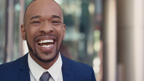 portrait of african american businessman outside corporate office building