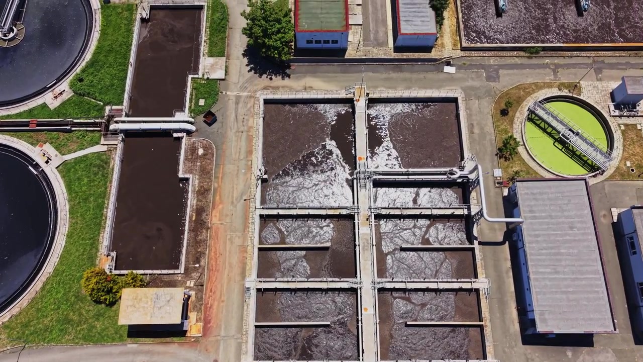 Water treatment facility shows tanks and processing area from above
