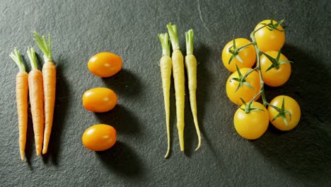 fresh carrots and tomatoes arranged in a row 4k