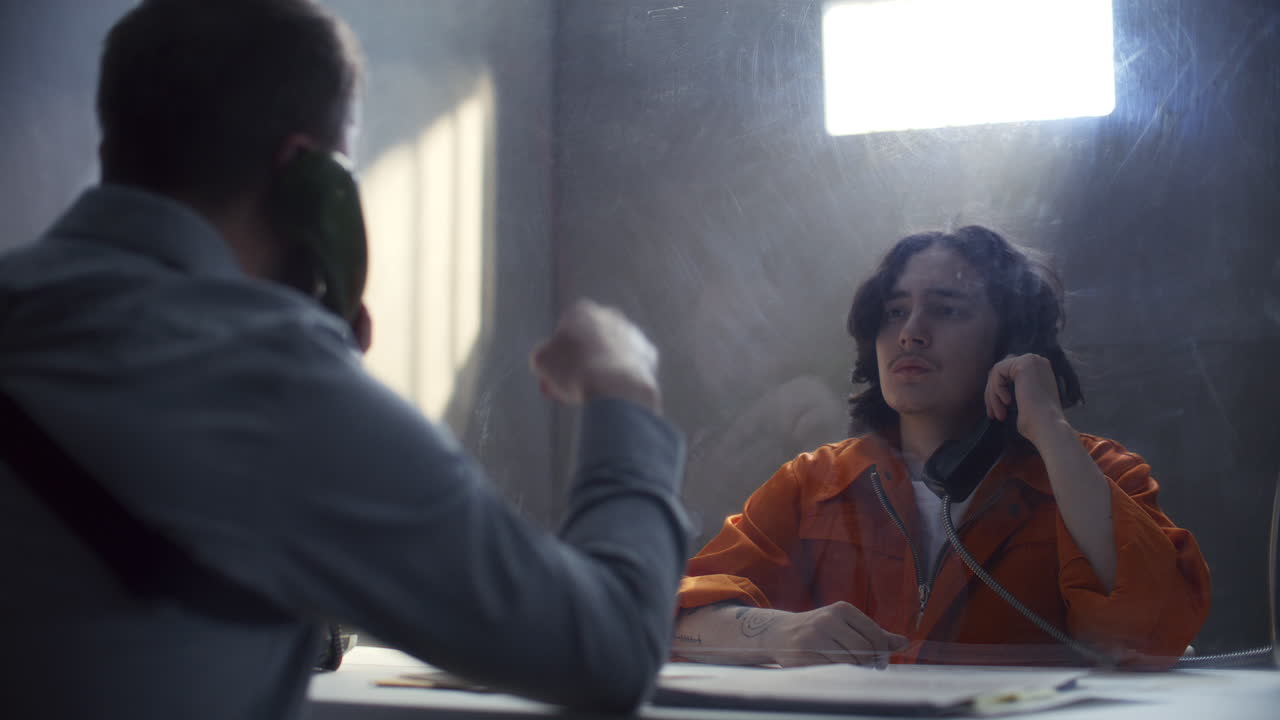 Detective Presenting Photo and Interrogating Inmate during Prison Visit