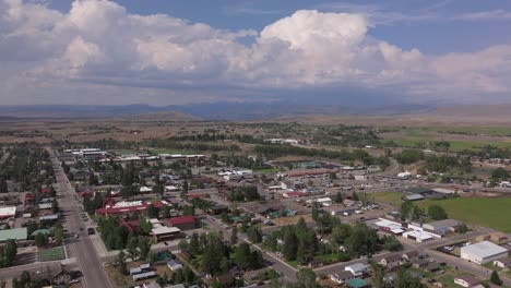 aerial establishing pan of pinedale, wyoming, with its surrounding open plains and distant mountain ranges