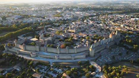 Aerial-dolly-left-shot-of-the-medieval-citadel-Carcassonne-under-golden-hour-light