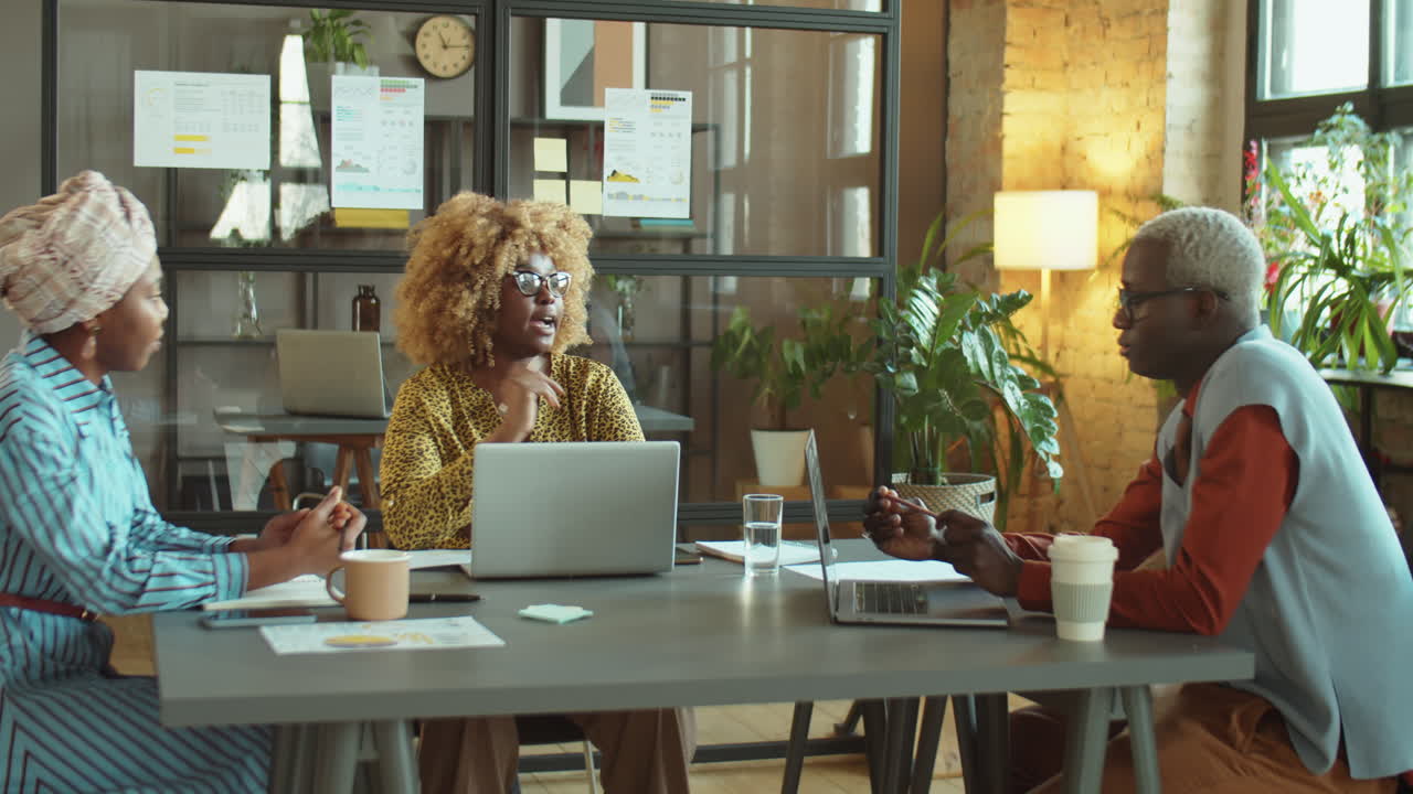 Team of African American Colleagues Having Business Meeting
