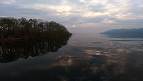 misty scene over lake windermere in the english lake district national park