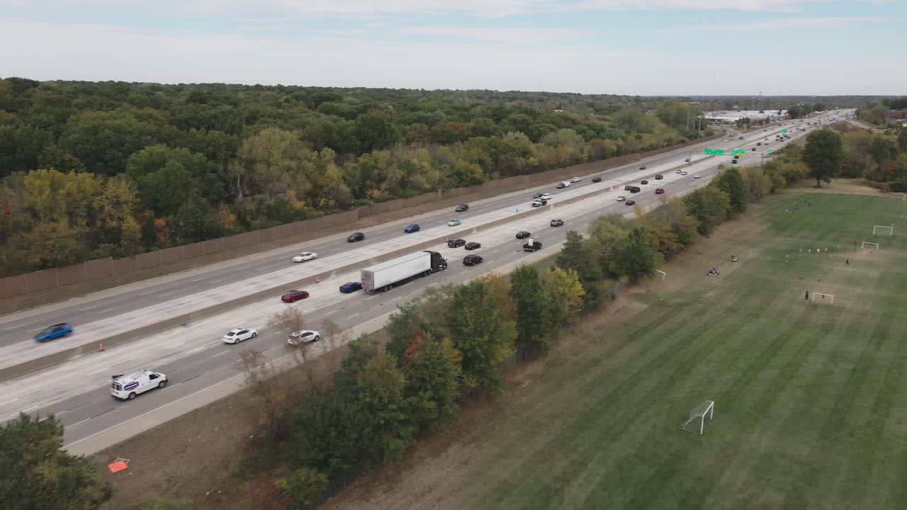 Highway Aerial View with Traffic and Surrounding Landscape