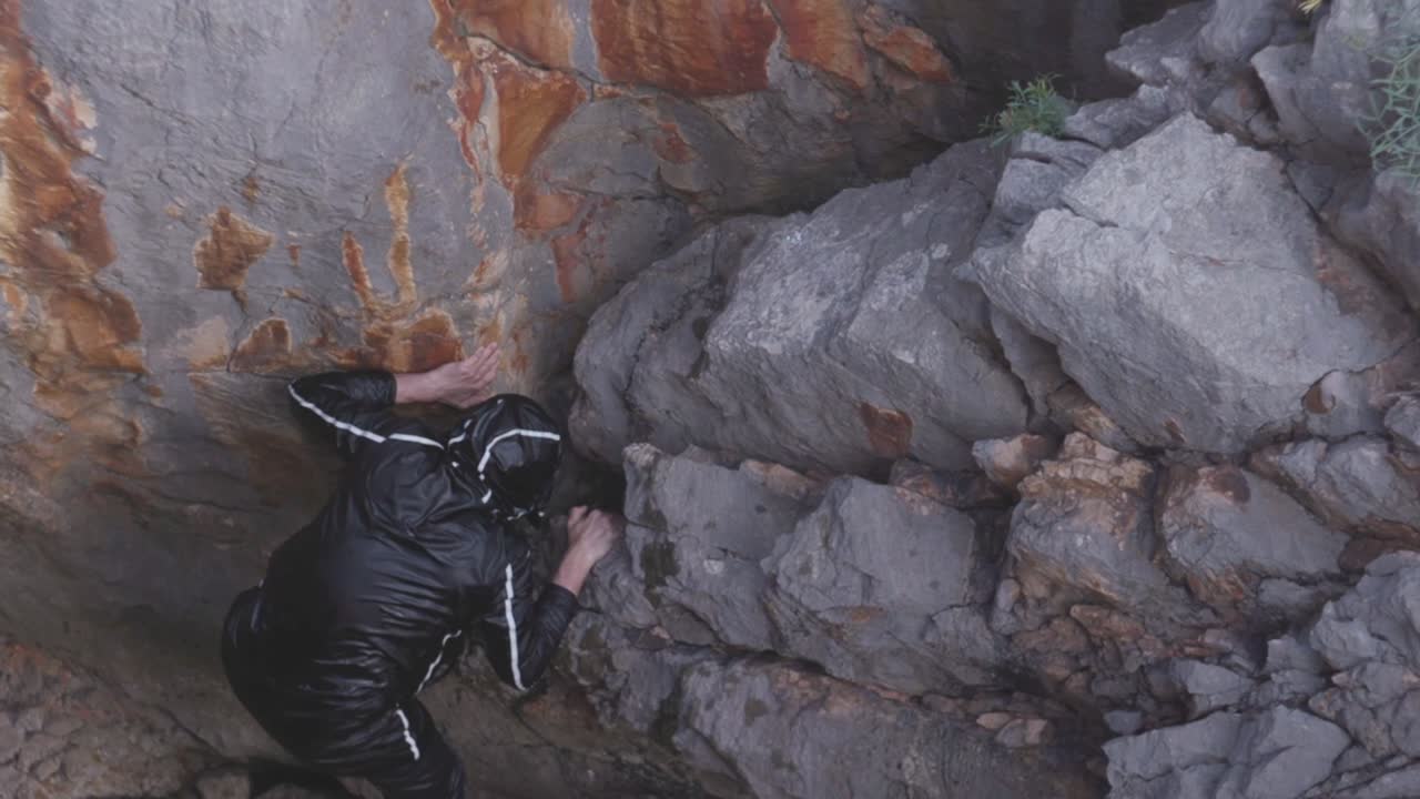 Man Rock Climbing