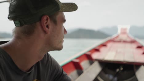 man on a boat enjoying the scenic view