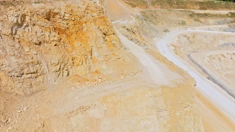 Quarry-Wall-In-The-Mountains---aerial-drone-shot