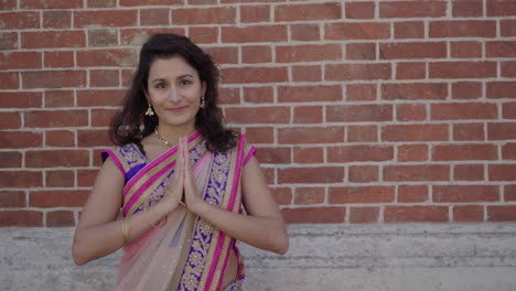 woman in a traditional clothing praying - medium shot