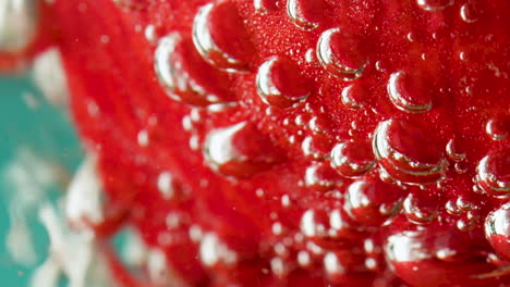 strawberry in water with bubbles