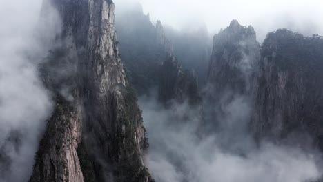 majestic mountains shrouded in fog: a breathtaking aerial view