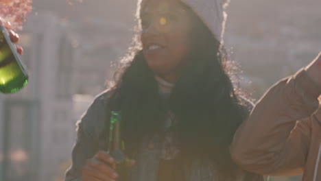 group of friends celebrating rooftop party making toast drinking alcohol enjoying diverse reunion celebration on weekend social gathering at sunset