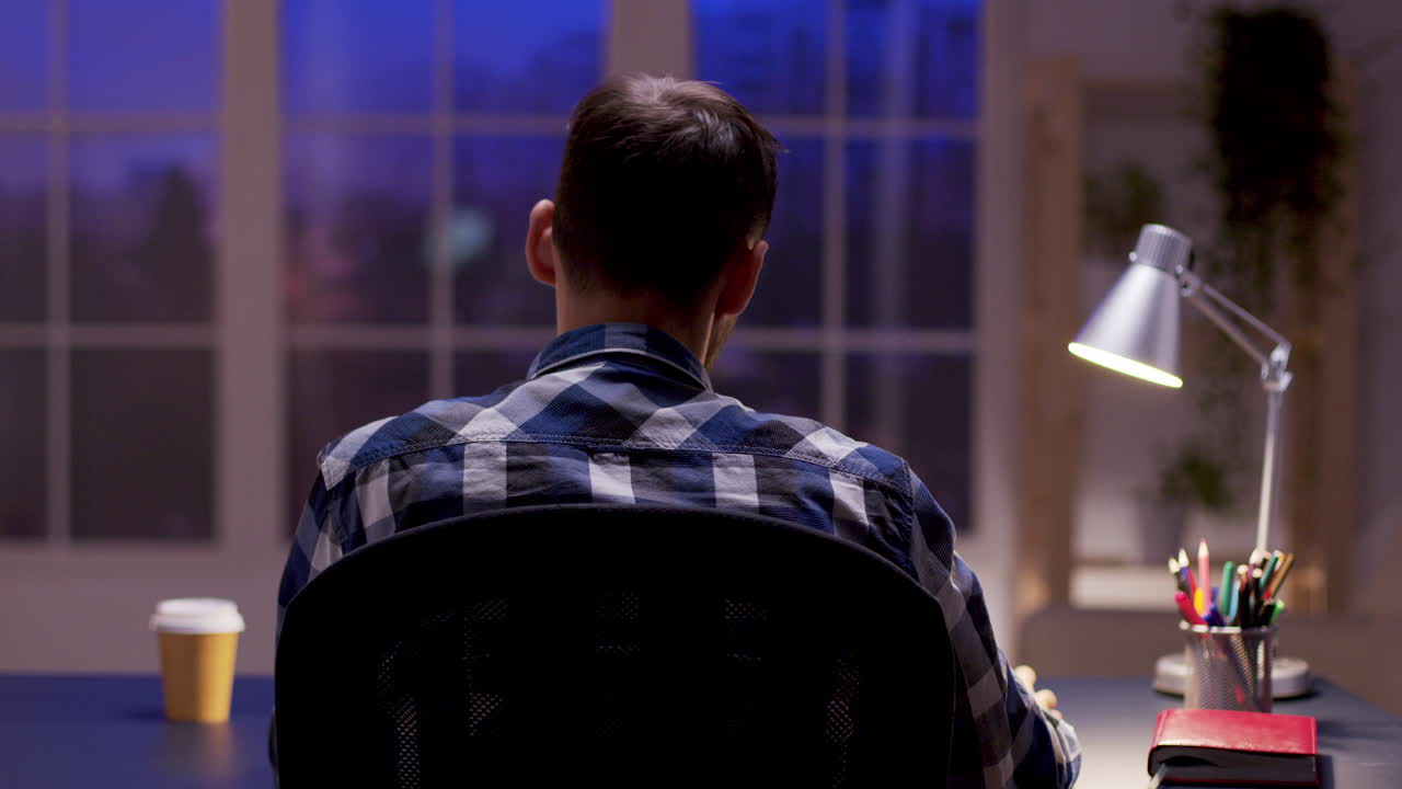Man working at desk at night