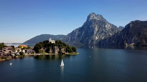 flight over traunkirchen church on traunsee lake, in salzkammergut, upper austria.