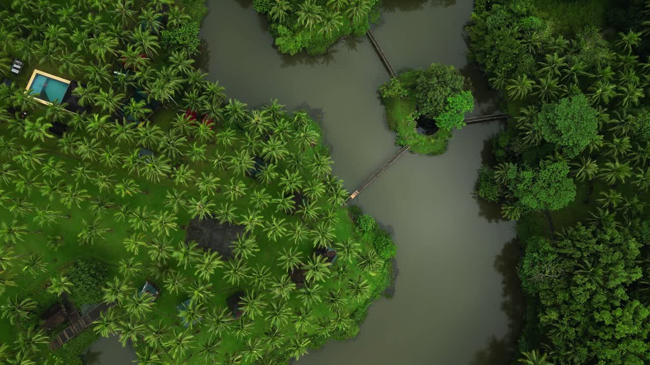 Rising slowly above the landscape, the shot unveils a stunning Laguna lake, dense forest, and a nearby pool—merging natural beauty with relaxing retreat vibes