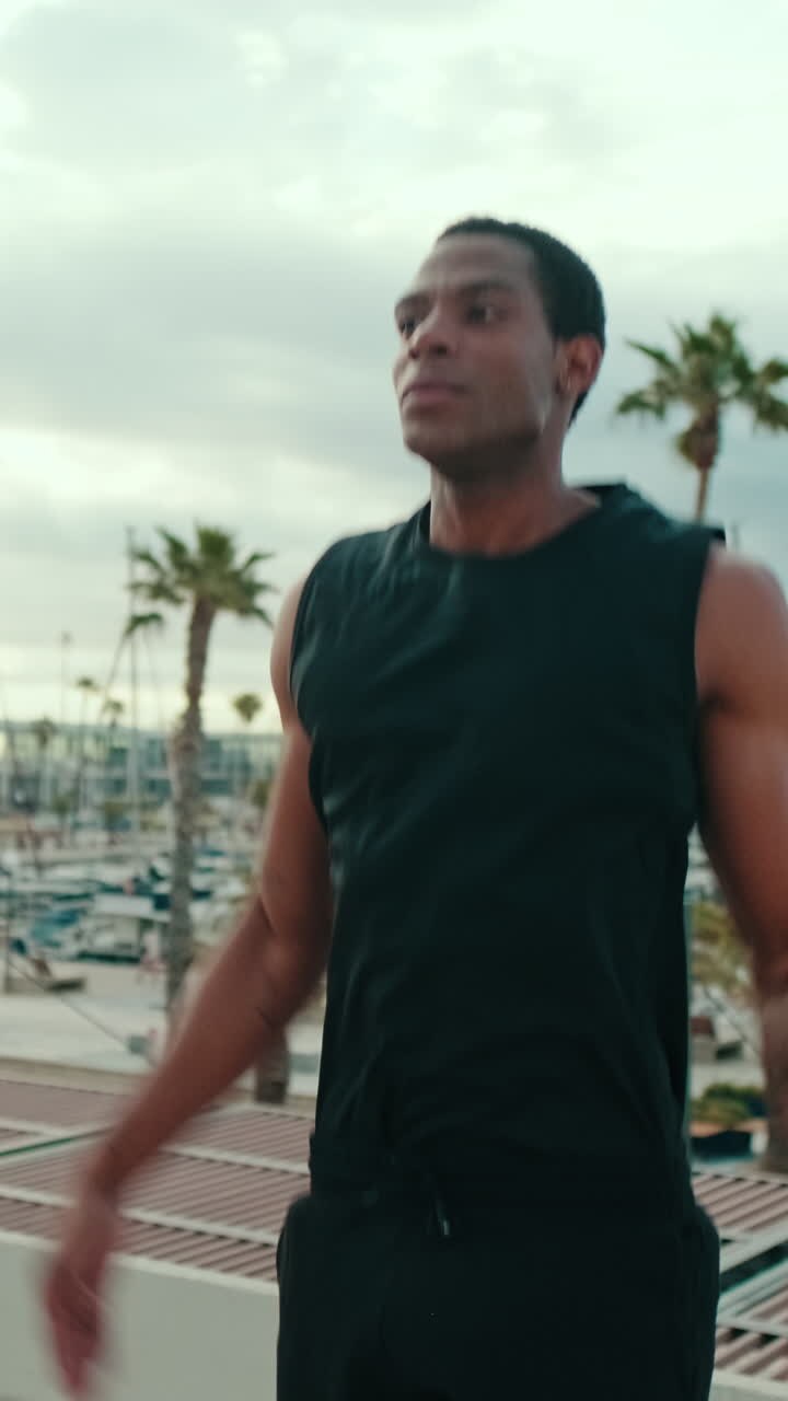 Man Doing Jumping Jacks at a Marina