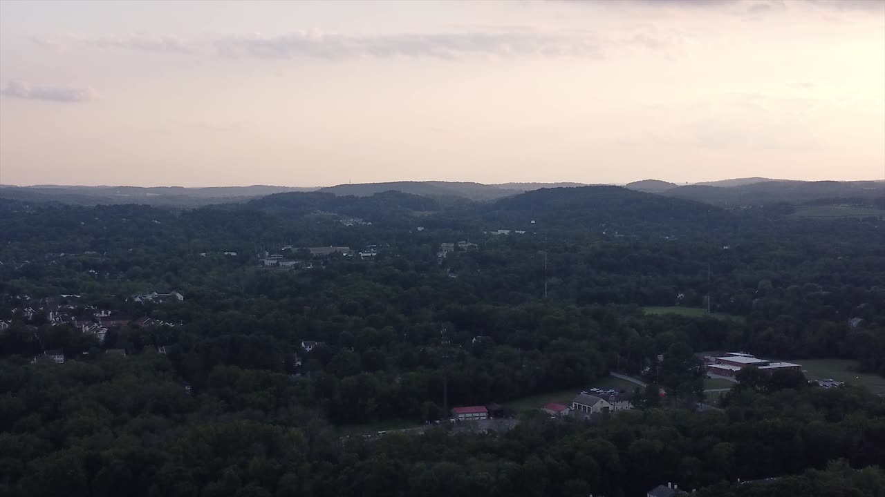 Sun setting over hill top