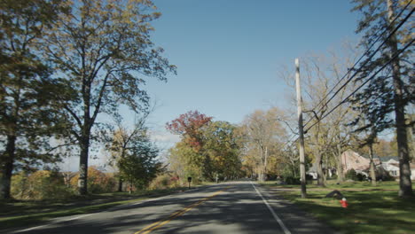 drive through a typical american suburb on a clear autumn day