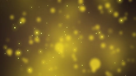 glowing yellow christmas light particles and bokeh lights moving on dark background