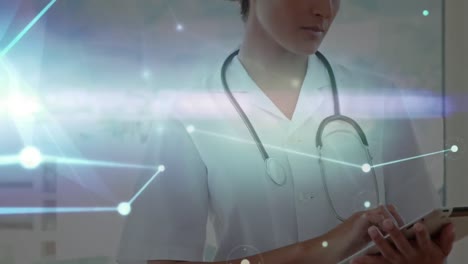 Animation-of-dots-interconnecting-with-lines-over-smiling-caucasian-female-doctor-using-tablet