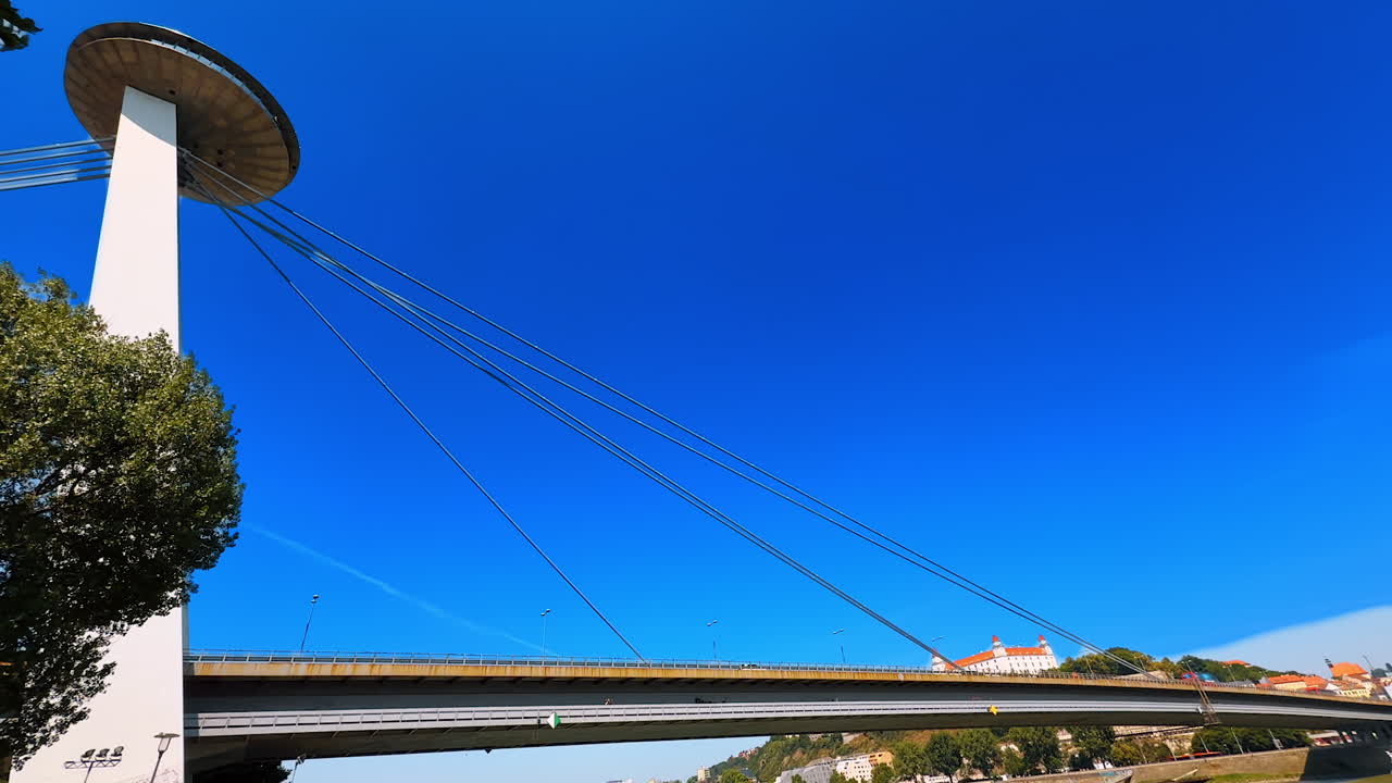 Saucer-shaped top of the UFO bridge with metal wires stretched. Low angle view at the bridge over the Danube in Bratislava, Slovakia