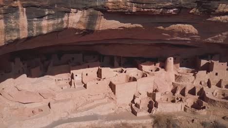 Aerial-shot-close-up-of-a-cave-in-the-cliffside