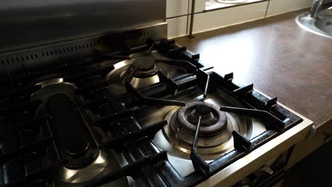 Shot-of-gas-stove-and-clean-brown-counter-top-in-a-old-restaurant-kitchen-before-the-day