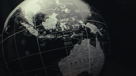 close-up of a black and white world globe