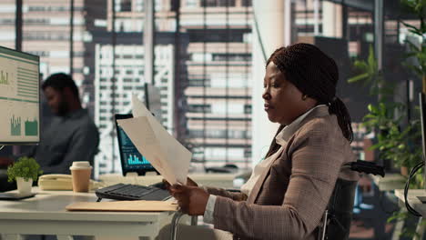 businesswoman in wheelchair working in office