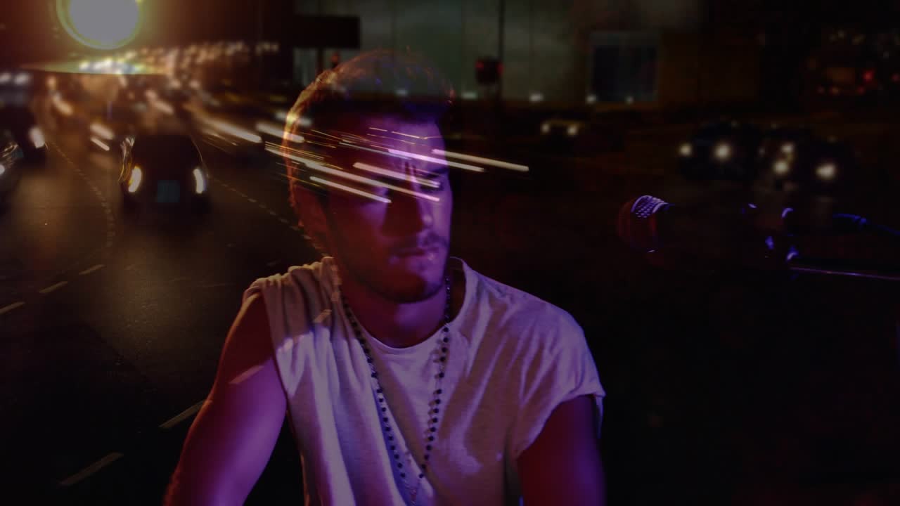 Male musician on lighting cue, moving arm and singing into microphone with light streak overlays
