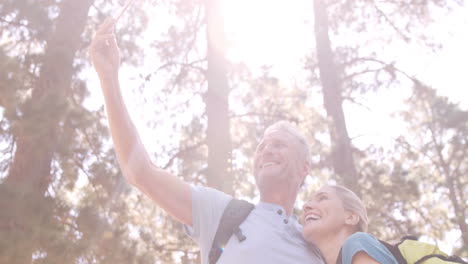 hiker couple taking selfie while hiking