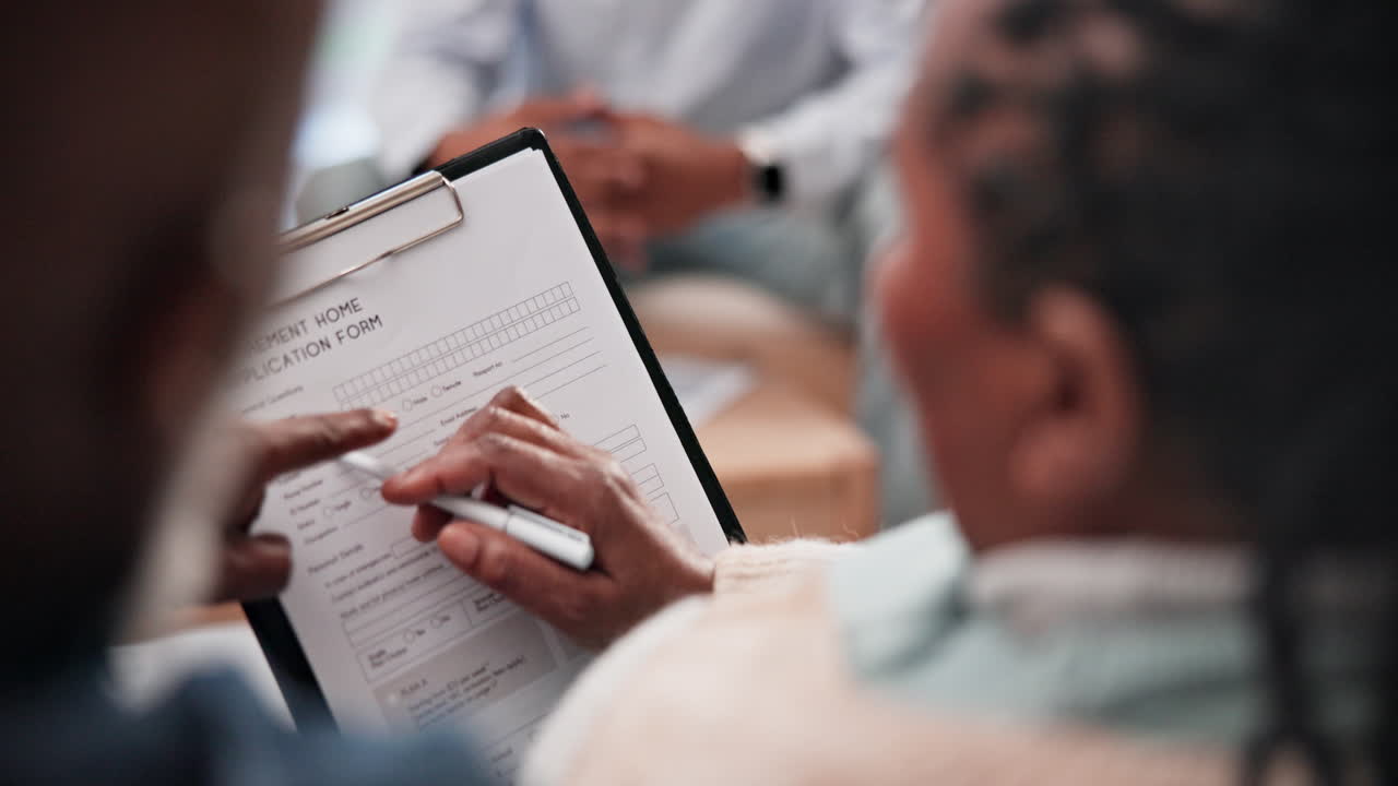 Talking, senior couple and a document