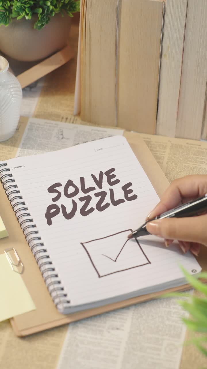 VERTICAL VIDEO OF TICKING OFF SOLVE PUZZLE FROM CHECKLIST