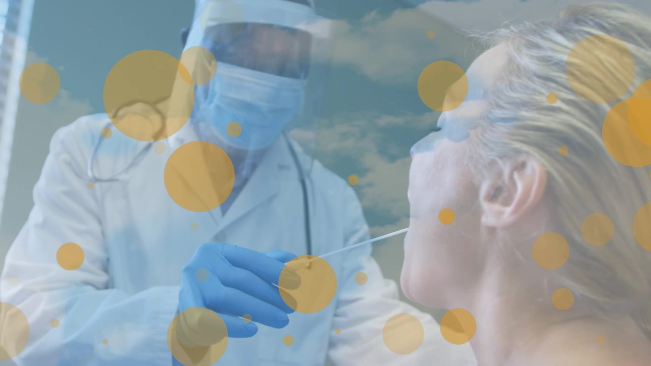 Animation of floating yellow dots over african american male doctor testing female patient