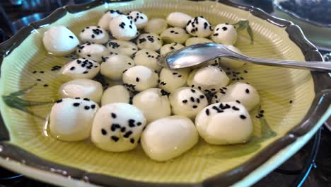 small mozzarella balls with sesame