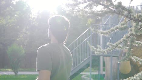 disabled teenager is outside on a beautiful sunny day. slow motion.