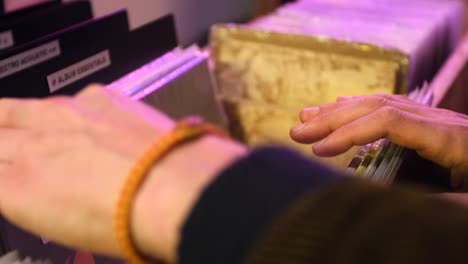 man browsing vinyl collection in store