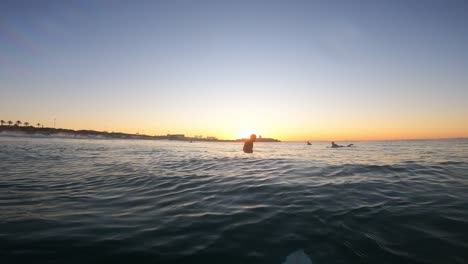 Famous,-beautiful-beach-at-sunset-with-calm-sea-near-fort-of-saint-Julian-in-Carcavelos,-in-summer-very-popular,-sandy-coast-have-a-fantastic-view-of-friendship-and-amazing-sunrise