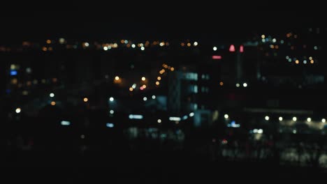 blurred night city background with colored bokeh. view of the city from a height out of focus