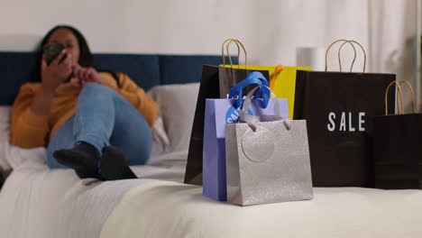 woman relaxing at home after online shopping