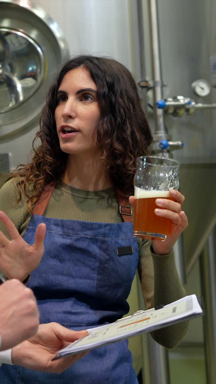 Brewery Workers Inspecting Beer