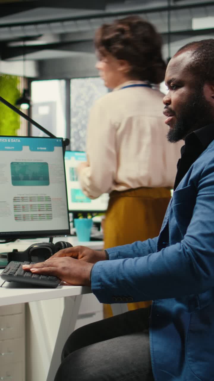 Vertical Video Black employee using data and technology for business management