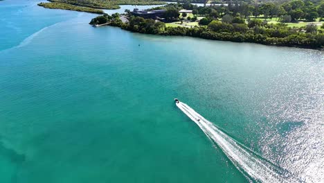 a boat travels along the scenic tweed river