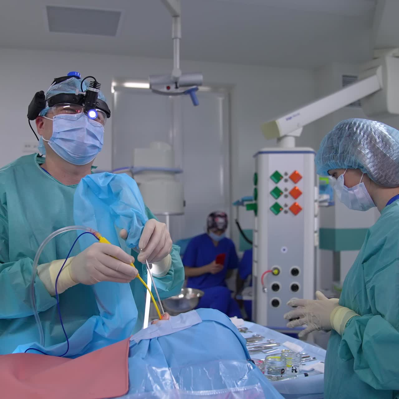 Surgery specialists operating in hospital room. Operation teamwork in uniform