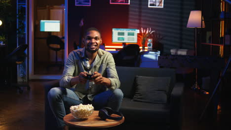 vertical video cheerful confident person winning the video games championship